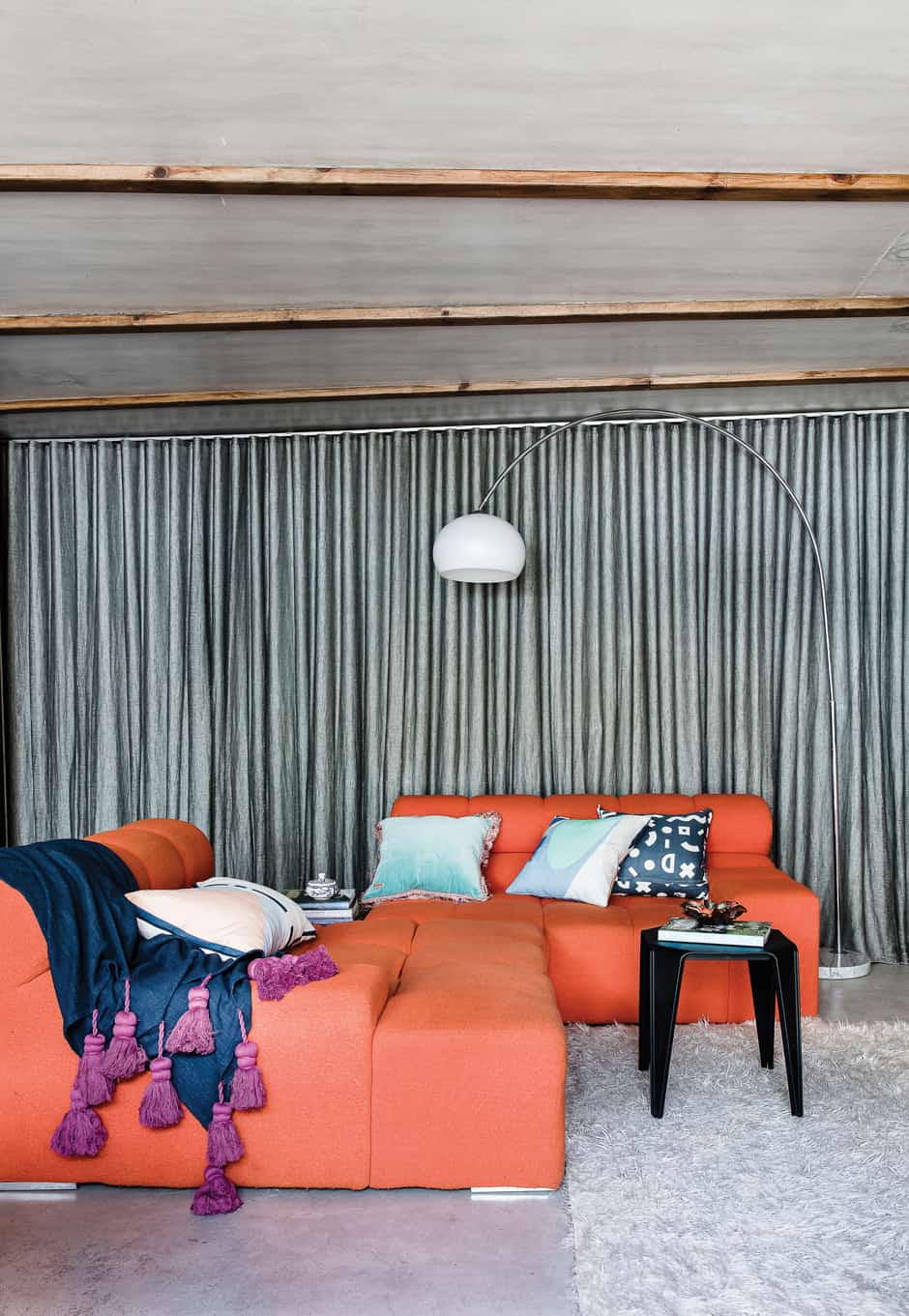 LIVING A sheer linen curtain creates a sense of privacy while letting in a little light, while the Tufty-Time sofa designed by Patricia Urquiola for B&B Italia provides a colourful retro element teamed with cushions from Life Interiors and a Kip & Co throw. On the shelf is the self-portrait by Susanna’s mother (far right) that inspired Susanna to take the plunge into illustrating; the purple piece beside it is by New Zealand artist Tracey Tawhiao.